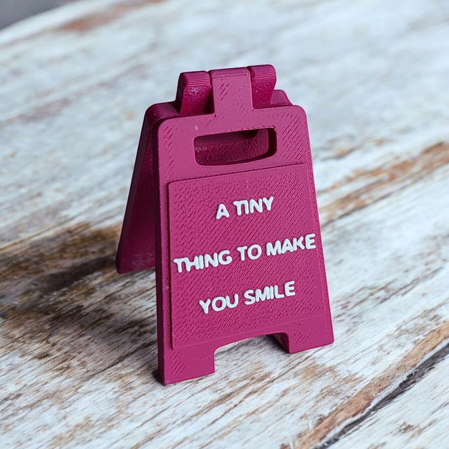 A Tiny Thing To Make You Smile Sign